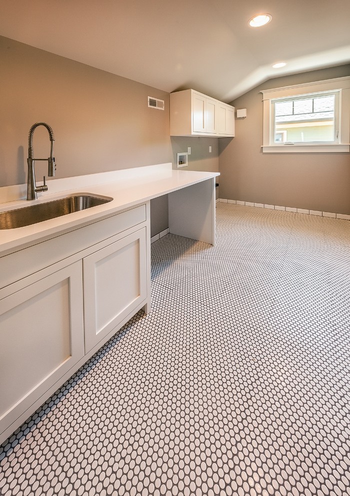 Large classic galley utility room in Indianapolis with a submerged sink, beaded cabinets, white cabinets, engineered stone countertops, ceramic flooring, a side by side washer and dryer and white floors.