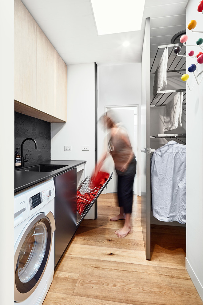 This is an example of a contemporary utility room in Melbourne.