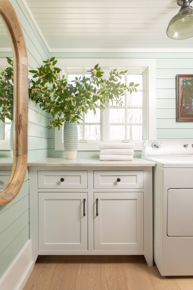 Example of a beach style laundry room design in Other