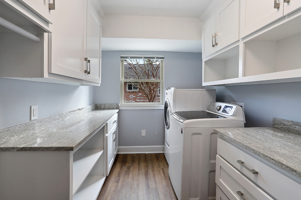 Dedicated laundry room - mid-sized transitional galley vinyl floor and brown floor dedicated laundry room idea in New Orleans with shaker cabinets, white cabinets, granite countertops, gray walls, a side-by-side washer/dryer and gray countertops