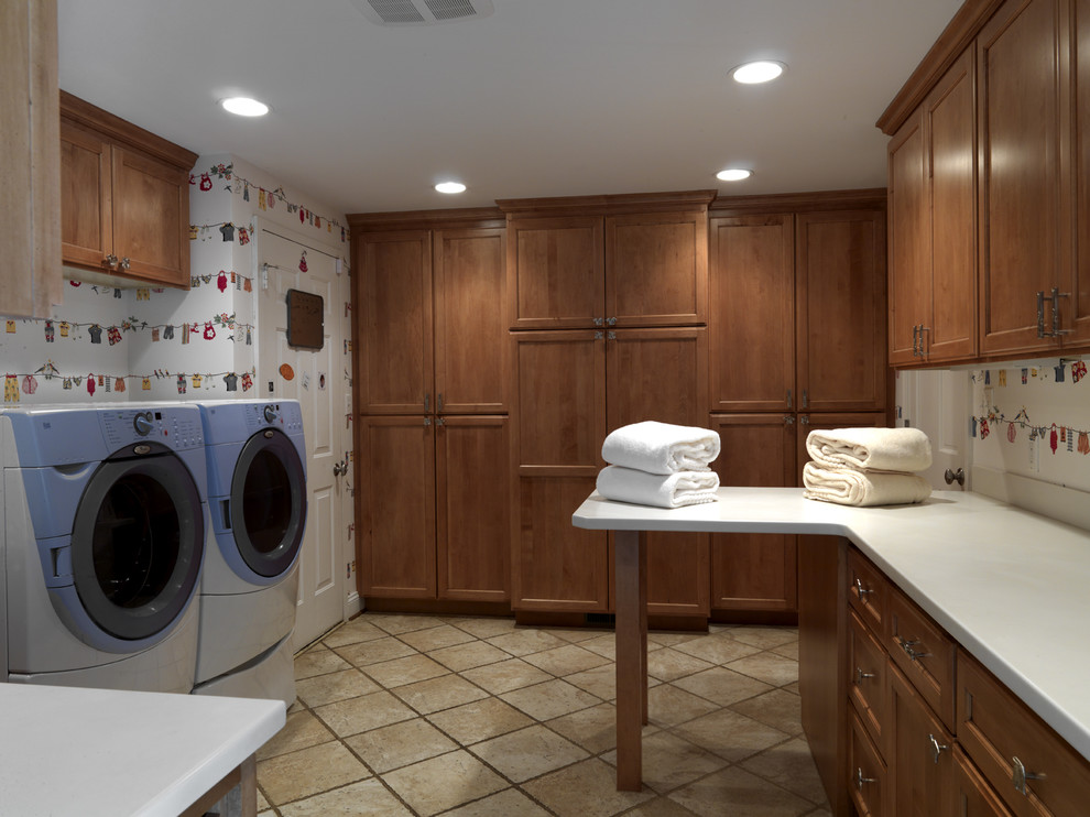 Classic utility room in DC Metro with a side by side washer and dryer and white worktops.