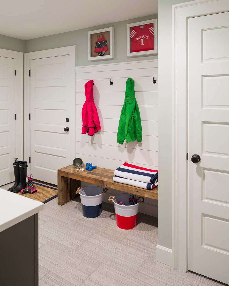 Photo of a medium sized nautical utility room in Seattle with a submerged sink, shaker cabinets, grey cabinets, quartz worktops, grey walls, porcelain flooring, a side by side washer and dryer and beige floors.