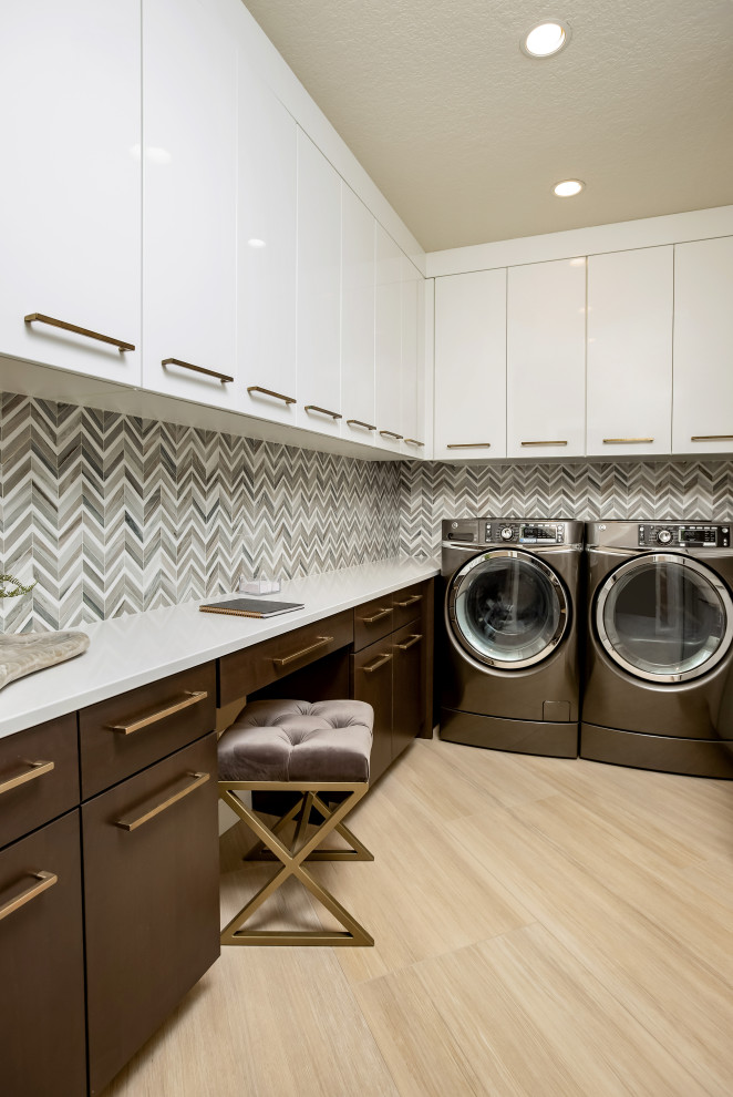 Utility room - mid-sized modern u-shaped beige floor utility room idea in Other with an undermount sink, flat-panel cabinets, marble countertops, gray walls, a side-by-side washer/dryer and white countertops