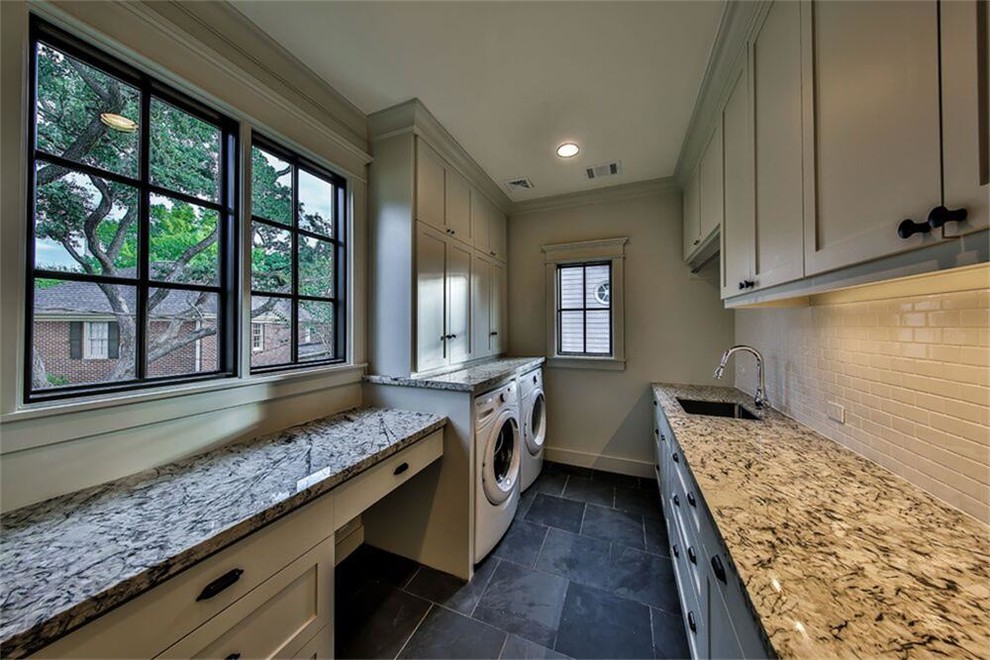 This is an example of a large country galley utility room in Houston with a submerged sink, shaker cabinets, grey cabinets, granite worktops, grey walls and slate flooring.