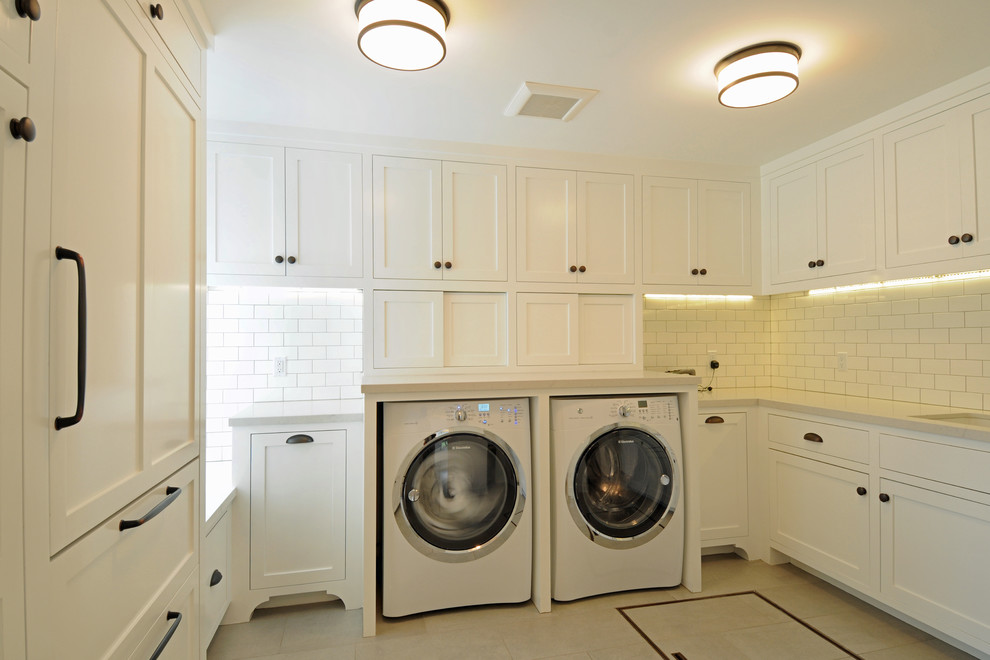 Mid-sized elegant u-shaped porcelain tile dedicated laundry room photo in Los Angeles with an undermount sink, shaker cabinets, white cabinets, white walls and a side-by-side washer/dryer