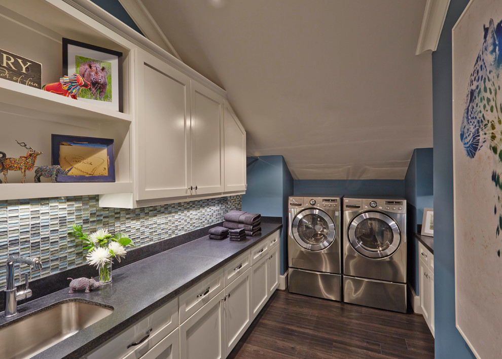 Dedicated laundry room - mid-sized transitional u-shaped medium tone wood floor and brown floor dedicated laundry room idea in Other with a drop-in sink, shaker cabinets, white cabinets, quartzite countertops, blue walls, a side-by-side washer/dryer and gray countertops