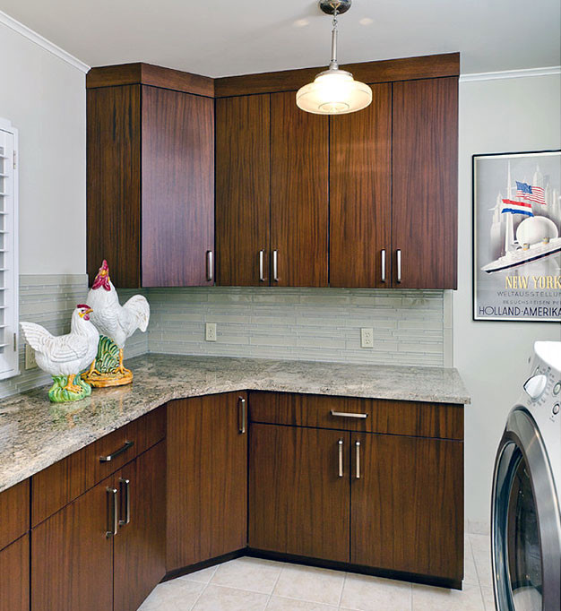 Dedicated laundry room - huge contemporary l-shaped porcelain tile dedicated laundry room idea in Other with an undermount sink, flat-panel cabinets, dark wood cabinets, granite countertops, beige walls and a side-by-side washer/dryer