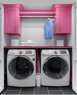 A pink and white iron sitting on top of a table photo – Laundry