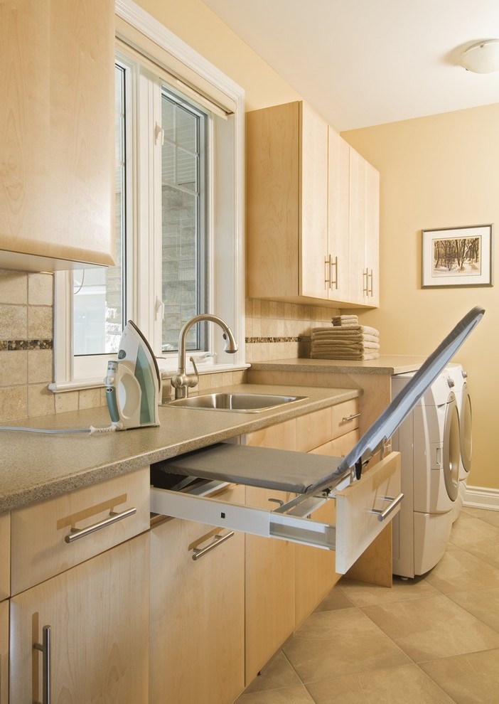 Contemporary utility room in Toronto with grey worktops.