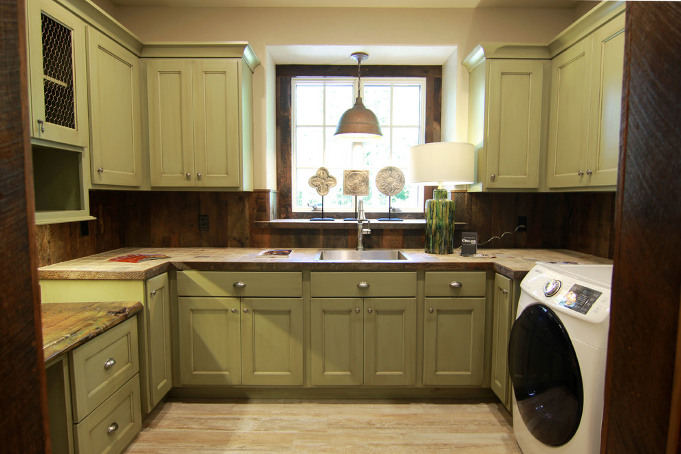 Photo of a large farmhouse u-shaped utility room in Other.