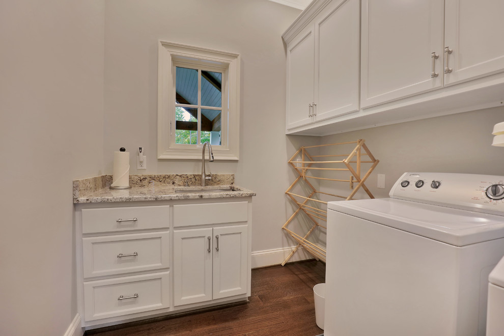 Design ideas for a medium sized classic separated utility room in Richmond with a submerged sink, recessed-panel cabinets, white cabinets, granite worktops, white walls, medium hardwood flooring and a side by side washer and dryer.