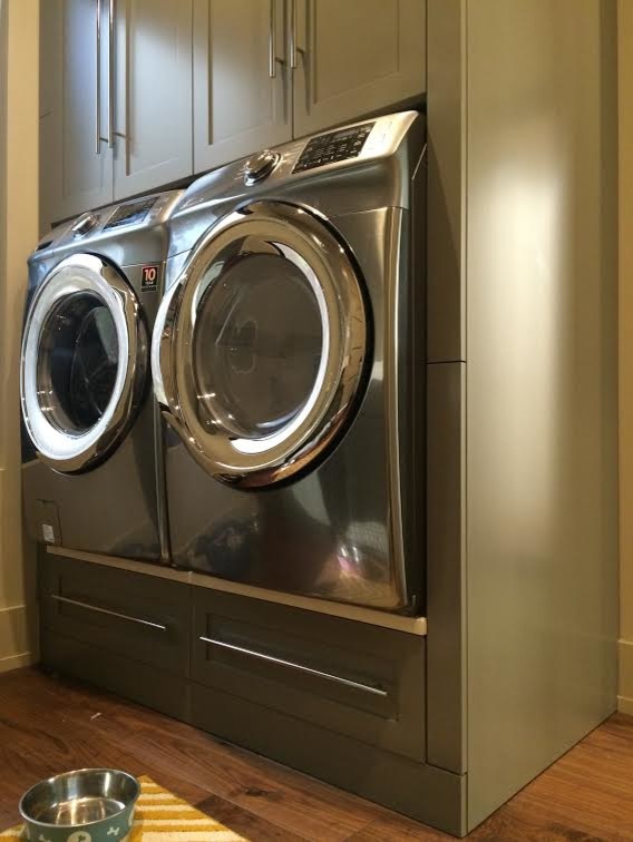 Inspiration for a small contemporary galley dark wood floor laundry room remodel in Miami with a side-by-side washer/dryer and gray cabinets