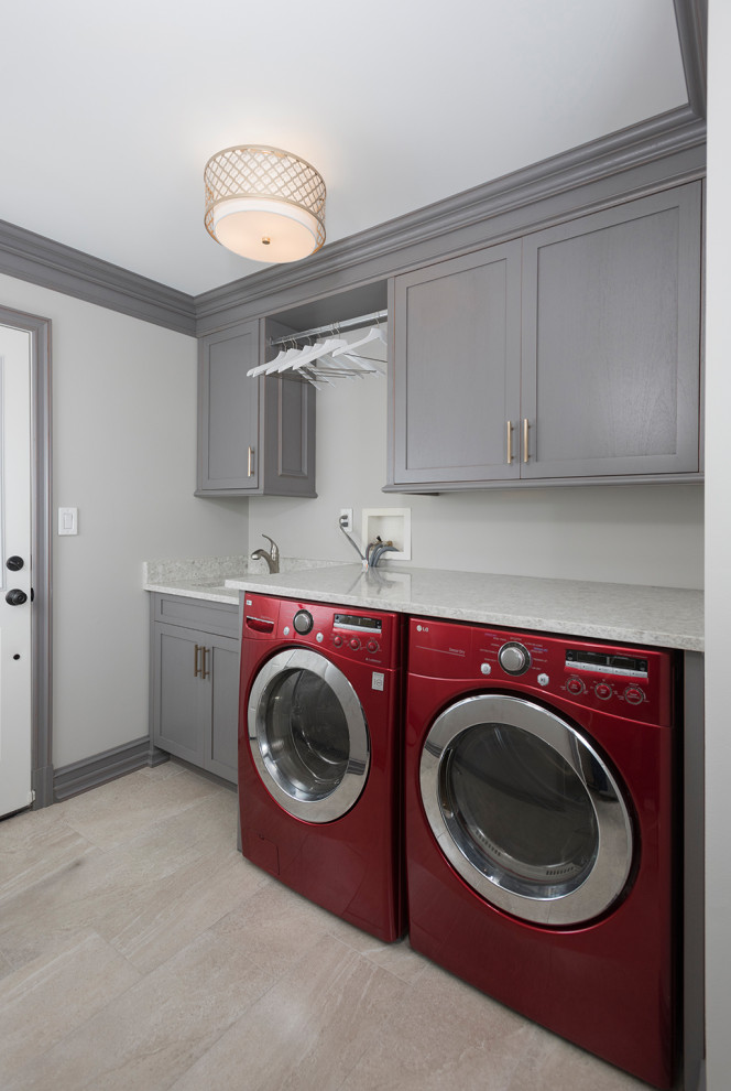 Example of a mid-sized minimalist single-wall laminate floor and gray floor laundry closet design in New York with recessed-panel cabinets, white cabinets, granite countertops, beige walls, a side-by-side washer/dryer, white countertops and a double-bowl sink