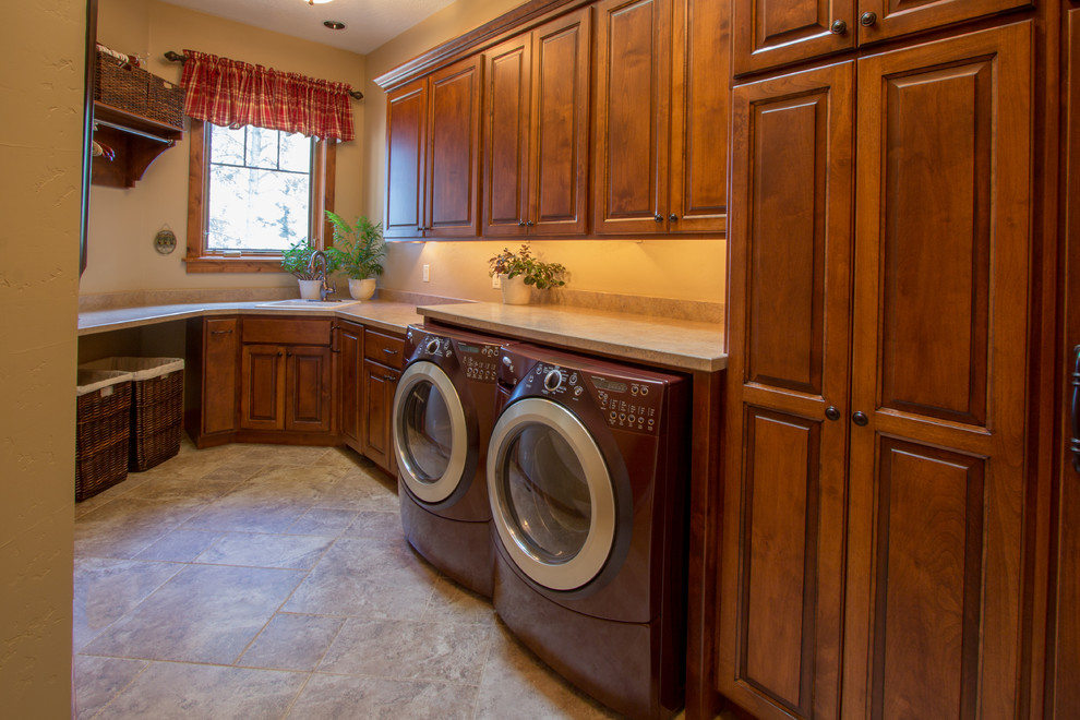 Laundry room - rustic laundry room idea in Other