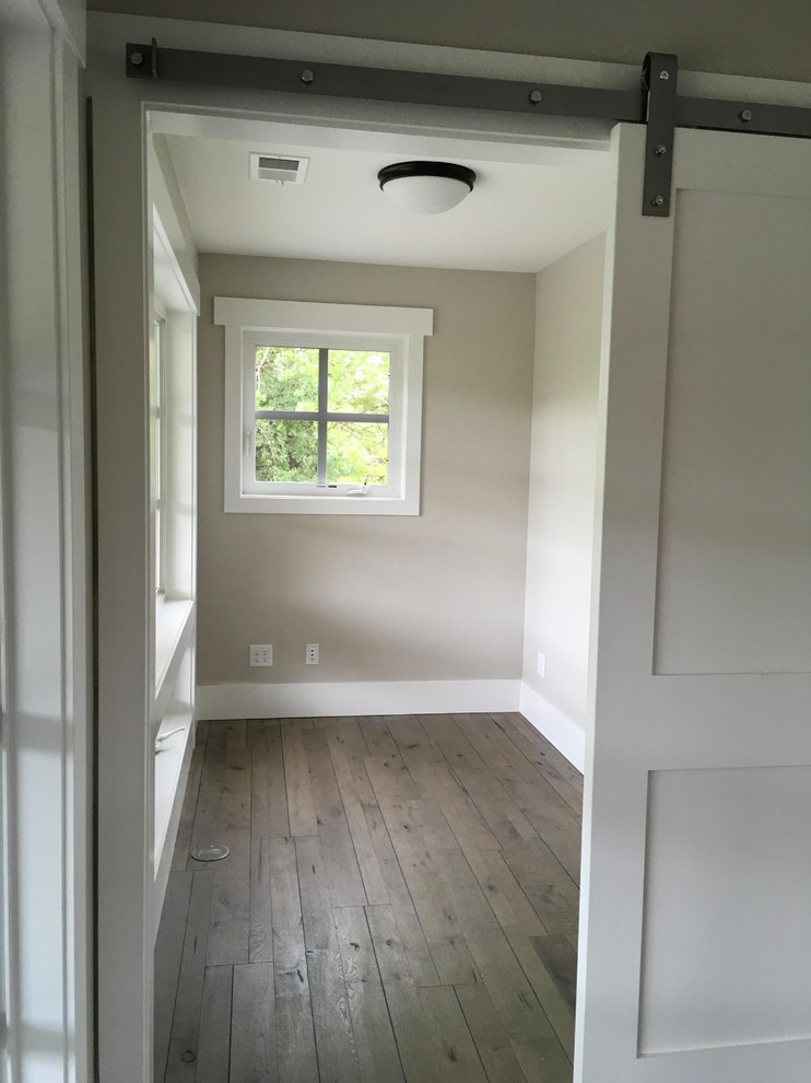 Dedicated laundry room - mid-sized cottage dark wood floor dedicated laundry room idea in Denver with white walls