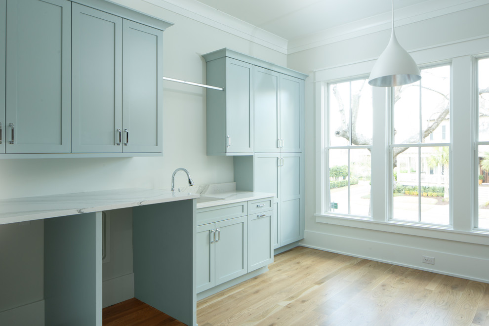 Photo of a beach style utility room in Charleston.