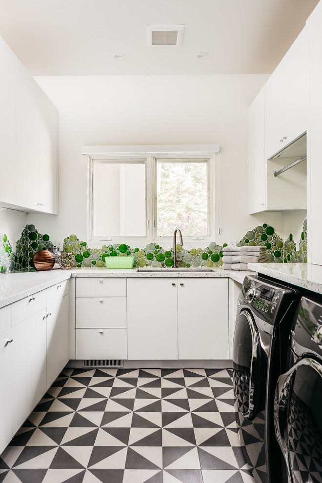 Dedicated laundry room - mid-sized transitional u-shaped multicolored floor dedicated laundry room idea in San Francisco with an undermount sink, flat-panel cabinets, white cabinets, white walls and a side-by-side washer/dryer