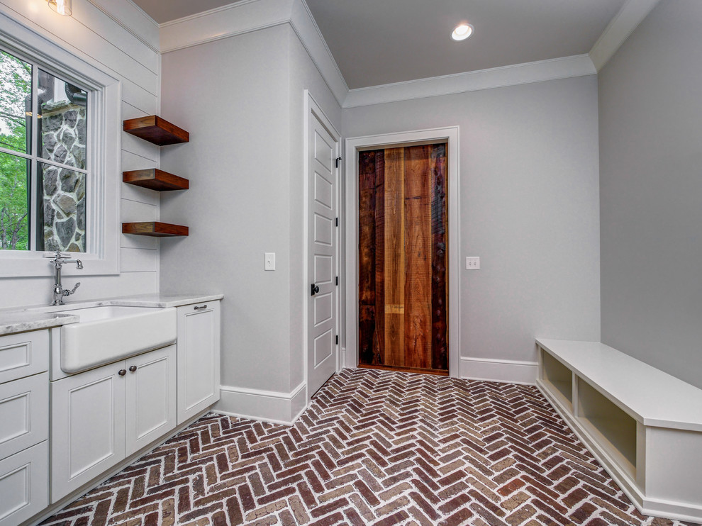 Inspiration for a large country laundry room remodel in Charlotte
