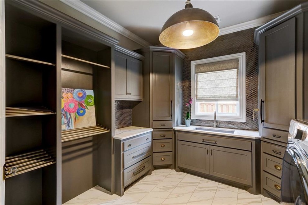 Inspiration for a large traditional u-shaped separated utility room in Charlotte with a submerged sink, shaker cabinets, grey cabinets, beige walls, marble flooring, a side by side washer and dryer, white floors and engineered stone countertops.