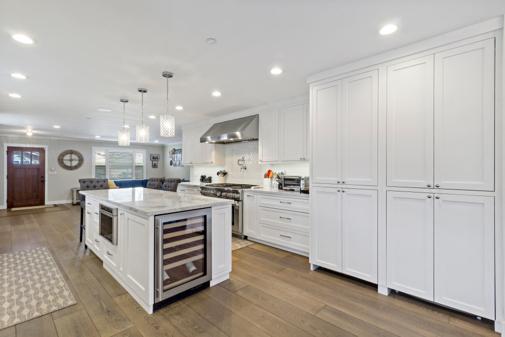 Small arts and crafts single-wall kitchen photo in San Francisco with recessed-panel cabinets and white cabinets