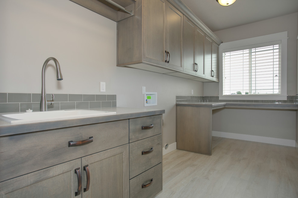 Transitional laundry room photo in Boise