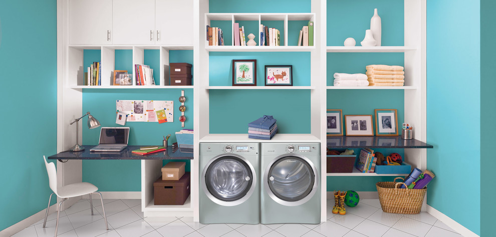 Large single-wall travertine floor and white floor utility room photo in Miami with open cabinets, white cabinets, blue walls and a side-by-side washer/dryer