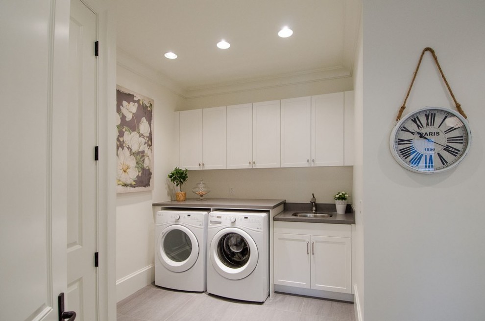 Transitional laundry room photo in Vancouver
