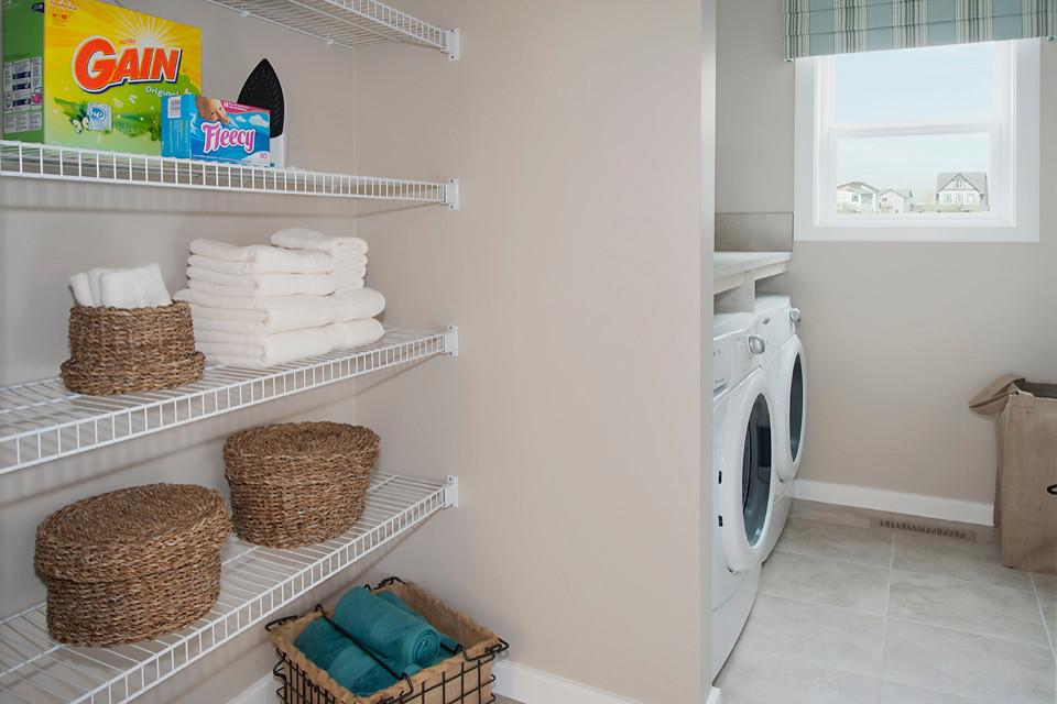 Laundry room - transitional laundry room idea in Calgary