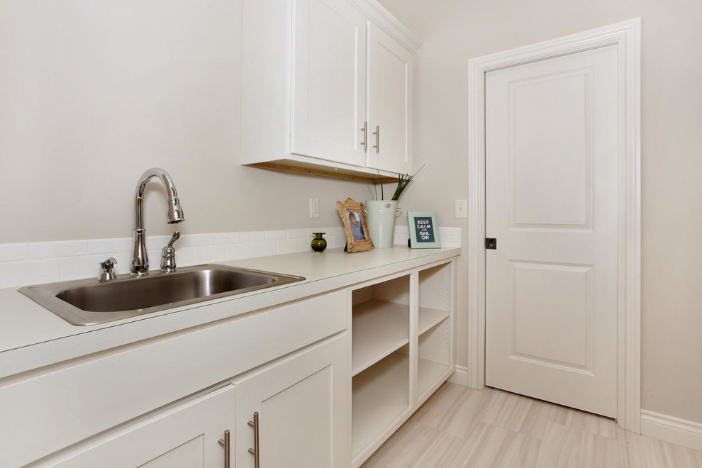 Example of a transitional laundry room design in Wichita