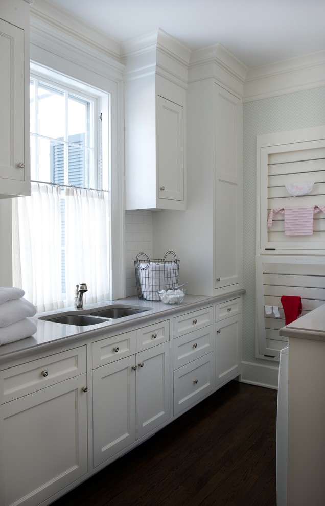 Inspiration for a classic utility room in New York with a submerged sink and white cabinets.