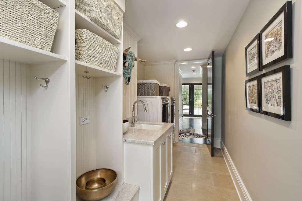 Inspiration for a mid-sized single-wall ceramic tile and beige floor dedicated laundry room remodel in Chicago with an undermount sink, recessed-panel cabinets, white cabinets, quartz countertops, beige walls, a side-by-side washer/dryer and gray countertops
