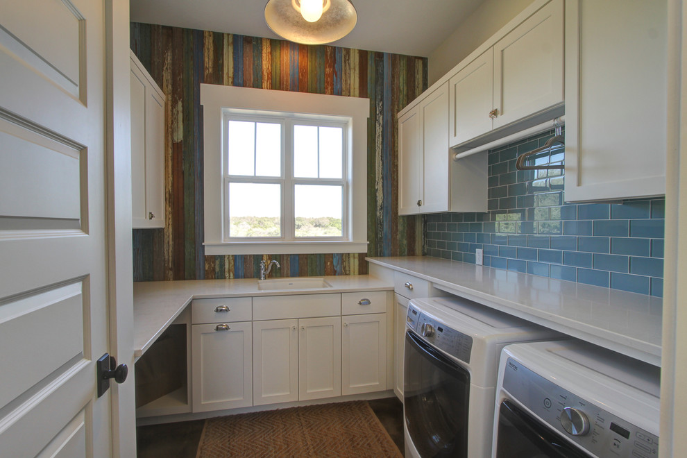 Inspiration for a cottage u-shaped medium tone wood floor dedicated laundry room remodel in Austin with an undermount sink, shaker cabinets, white cabinets, quartzite countertops, a side-by-side washer/dryer and multicolored walls