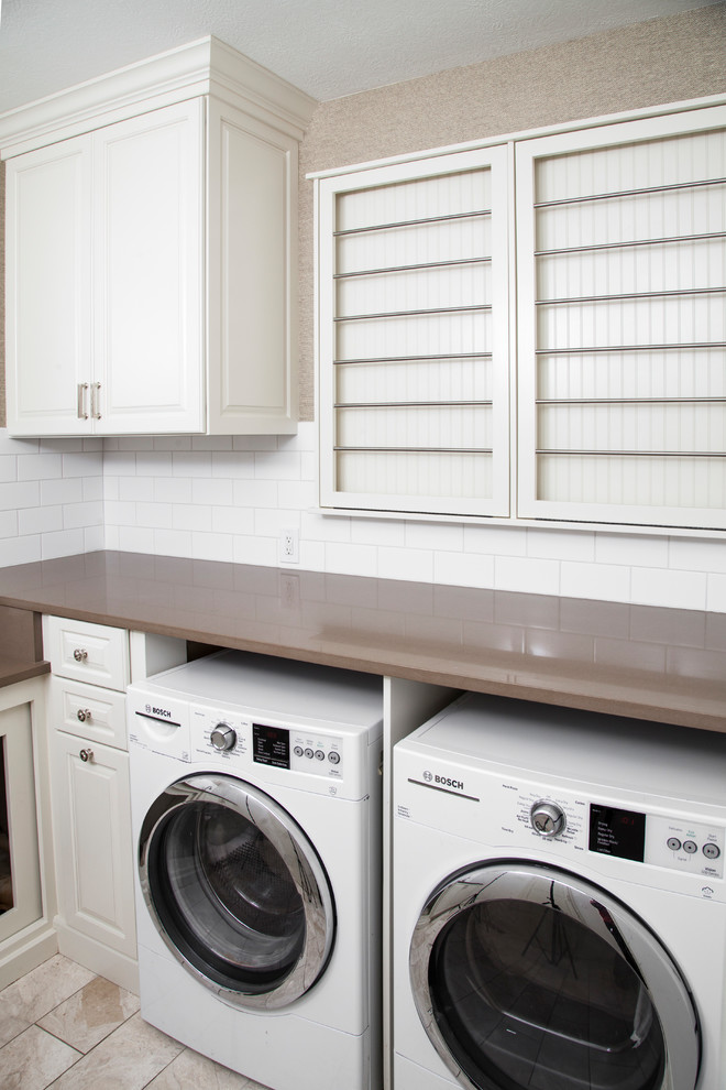 Mid-sized arts and crafts l-shaped porcelain tile and white floor dedicated laundry room photo in Indianapolis with shaker cabinets, white cabinets, beige walls and a side-by-side washer/dryer