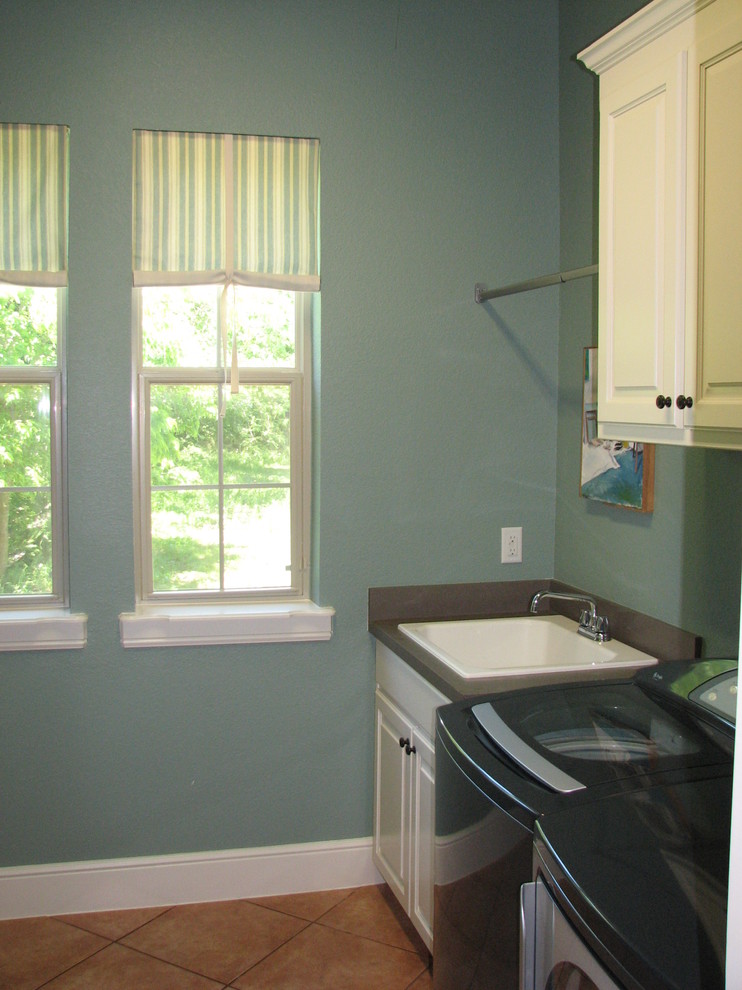 Tuscan laundry room photo in Dallas