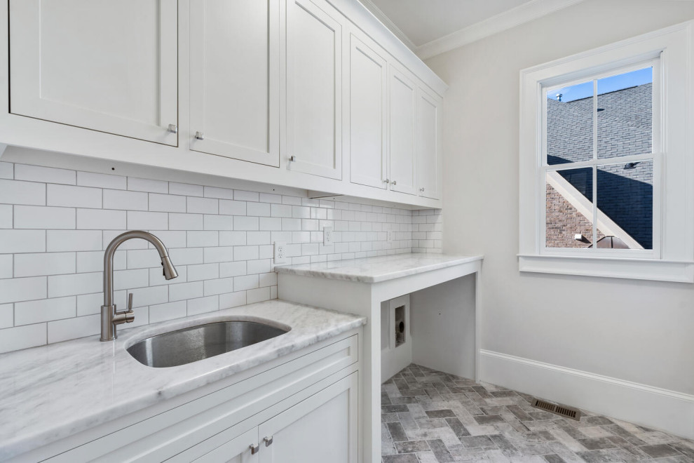 Example of a trendy laundry room design in Atlanta