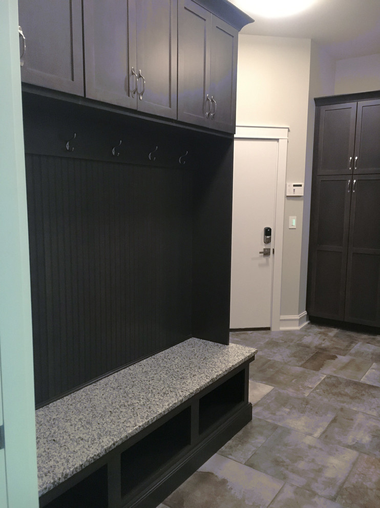 Photo of a large classic utility room in Other with a submerged sink, flat-panel cabinets, grey cabinets, granite worktops, grey walls and a side by side washer and dryer.