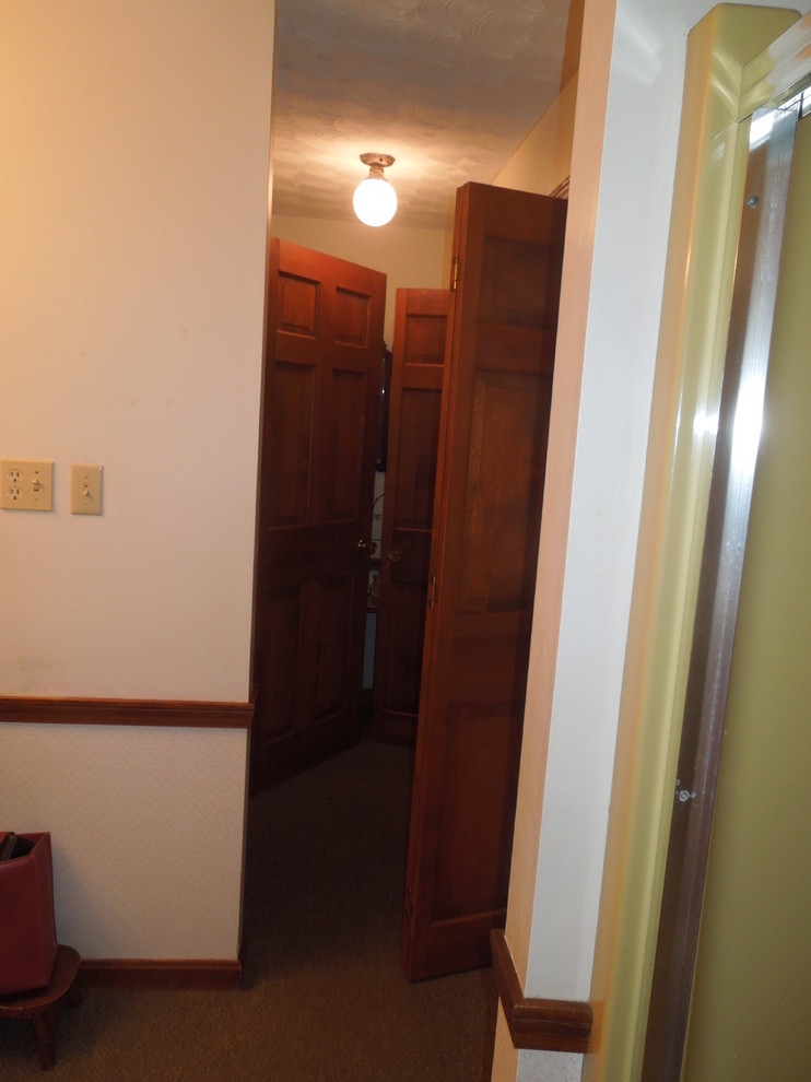 Photo of a medium sized traditional l-shaped utility room in Charleston with a submerged sink, recessed-panel cabinets, white cabinets, granite worktops, yellow walls, porcelain flooring and a side by side washer and dryer.