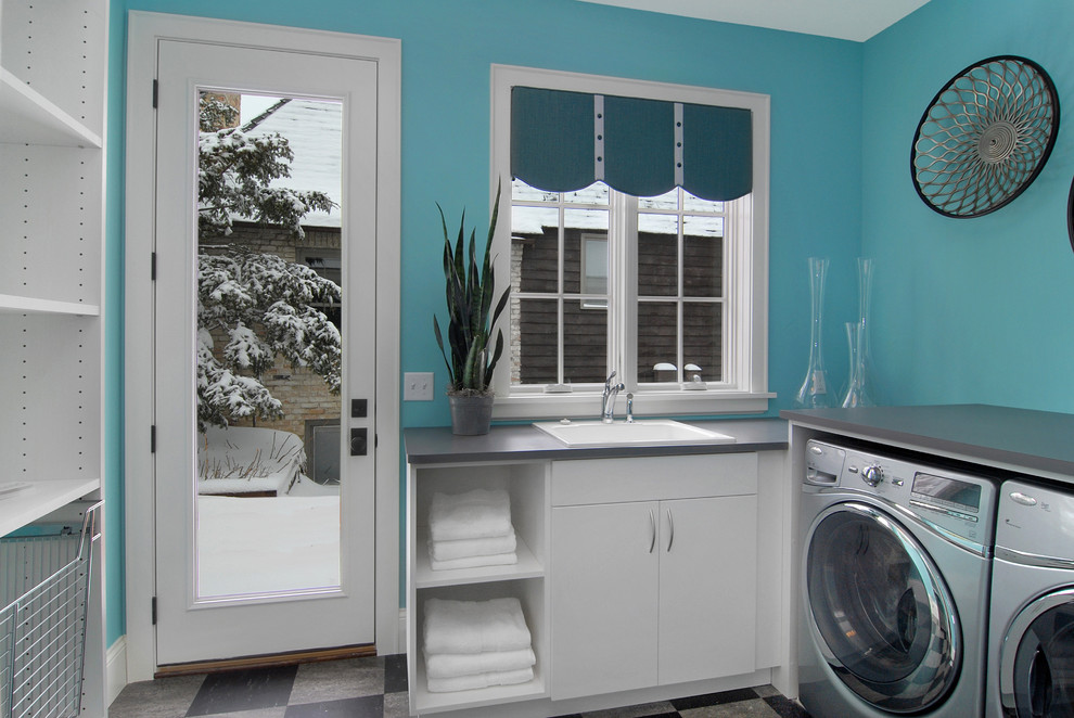 Laundry room - contemporary gray floor laundry room idea in Minneapolis with white cabinets and gray countertops