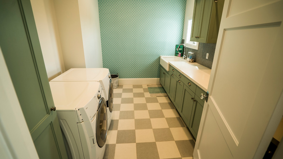 Photo of a medium sized coastal galley separated utility room in Salt Lake City with a belfast sink, shaker cabinets, green cabinets, composite countertops and a side by side washer and dryer.