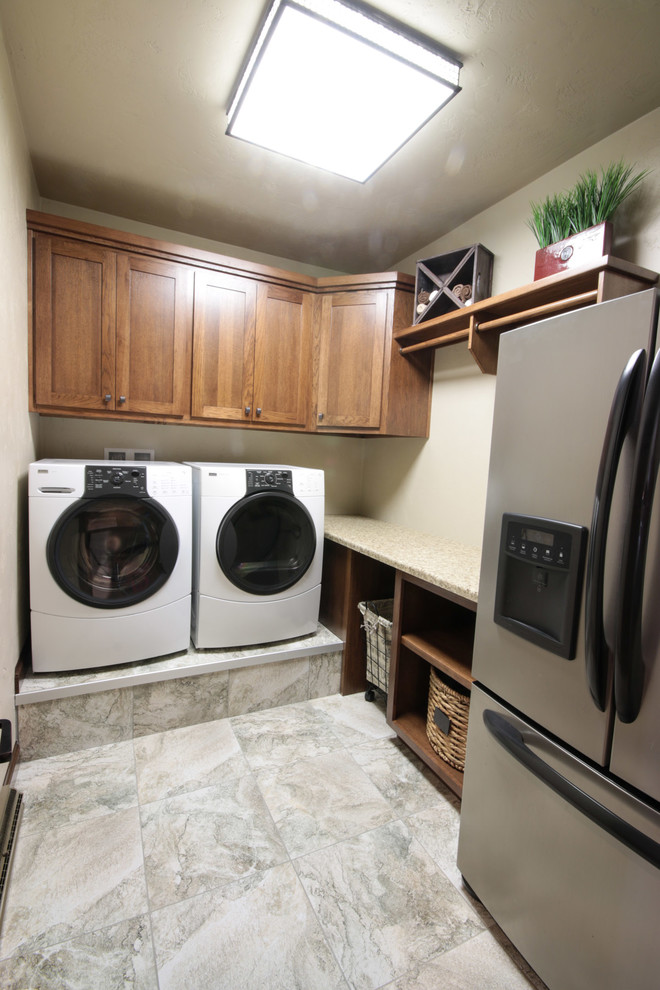 Utility room - mid-sized craftsman l-shaped utility room idea in Other with flat-panel cabinets, medium tone wood cabinets and a side-by-side washer/dryer