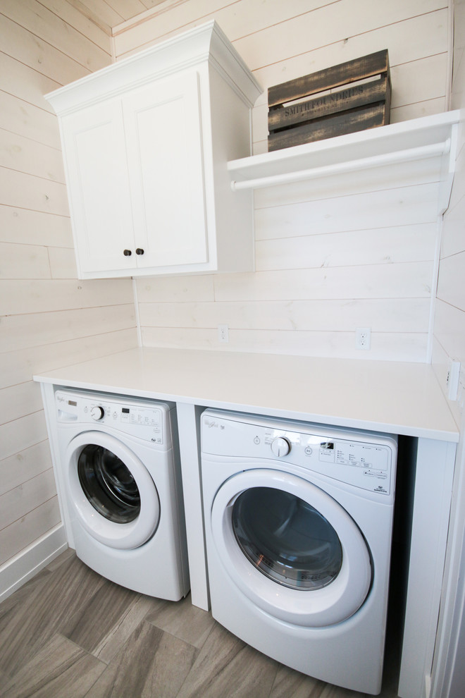 Inspiration for a medium sized traditional single-wall utility room in Other with shaker cabinets, white cabinets, engineered stone countertops, white walls, medium hardwood flooring and a side by side washer and dryer.