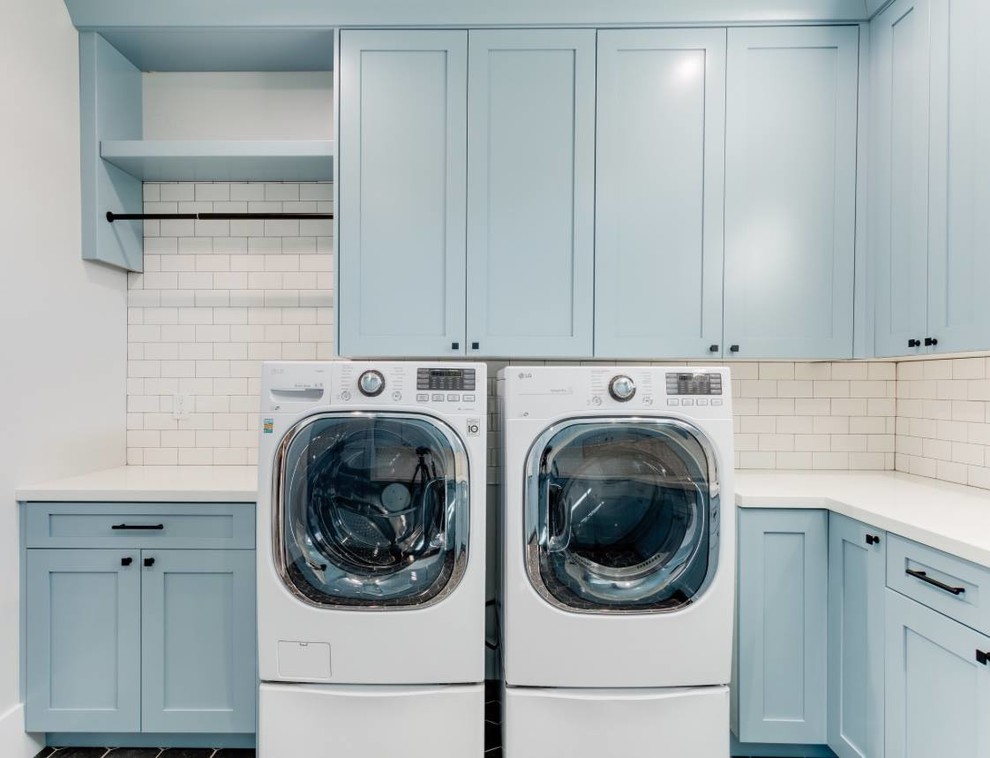 Example of a mid-sized transitional u-shaped dedicated laundry room design in Salt Lake City with an undermount sink, recessed-panel cabinets, blue cabinets, quartz countertops, a side-by-side washer/dryer and white countertops