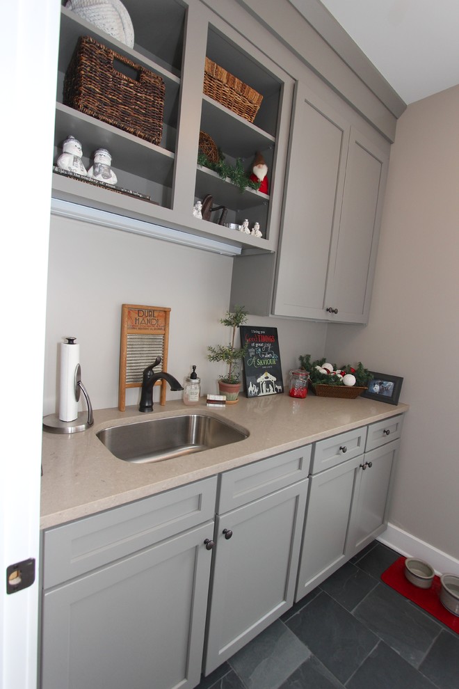 Inspiration for a mid-sized craftsman galley slate floor utility room remodel in Nashville with an undermount sink, shaker cabinets, gray cabinets, quartz countertops and gray walls