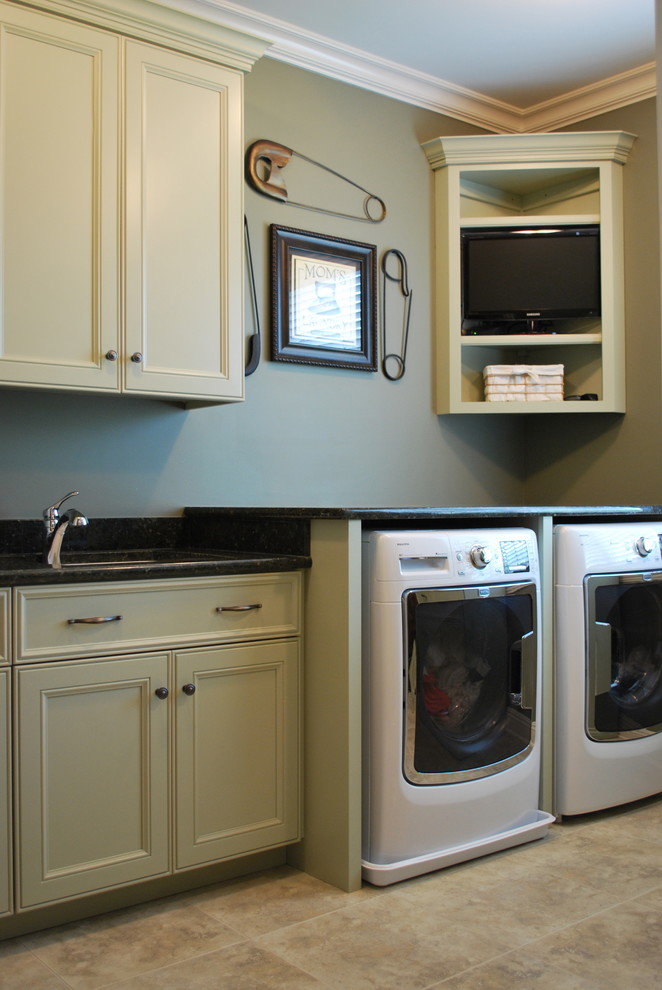 This is an example of a large classic u-shaped utility room in Chicago with a submerged sink, recessed-panel cabinets, beige cabinets, granite worktops, grey walls, porcelain flooring, a side by side washer and dryer and black worktops.