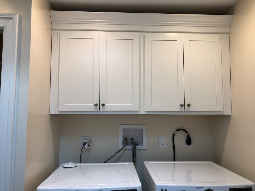 Utility room - mid-sized country single-wall ceramic tile and gray floor utility room idea in Philadelphia with an utility sink, shaker cabinets, white cabinets, white walls and a side-by-side washer/dryer