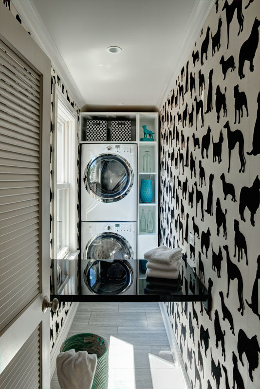 Inspiration for a small bohemian separated utility room in Chicago with open cabinets, white cabinets, ceramic flooring, a stacked washer and dryer and multi-coloured walls.