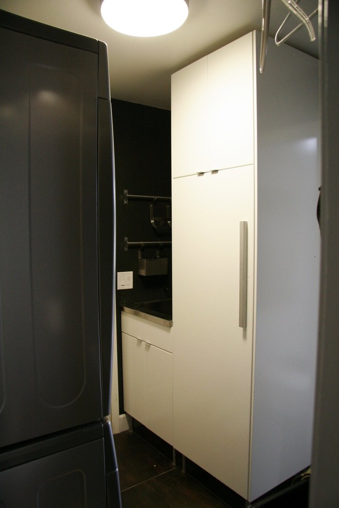Example of a trendy laundry room design in Seattle