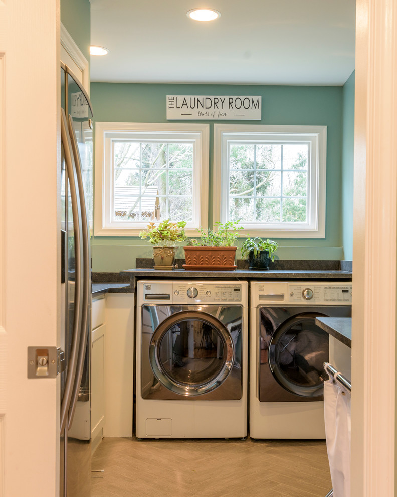 Design ideas for a small classic u-shaped utility room in DC Metro with a submerged sink, shaker cabinets, white cabinets, quartz worktops, blue walls, ceramic flooring and a side by side washer and dryer.