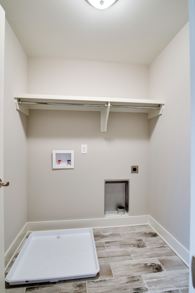 Small elegant single-wall porcelain tile laundry closet photo in Nashville with beige walls and a side-by-side washer/dryer