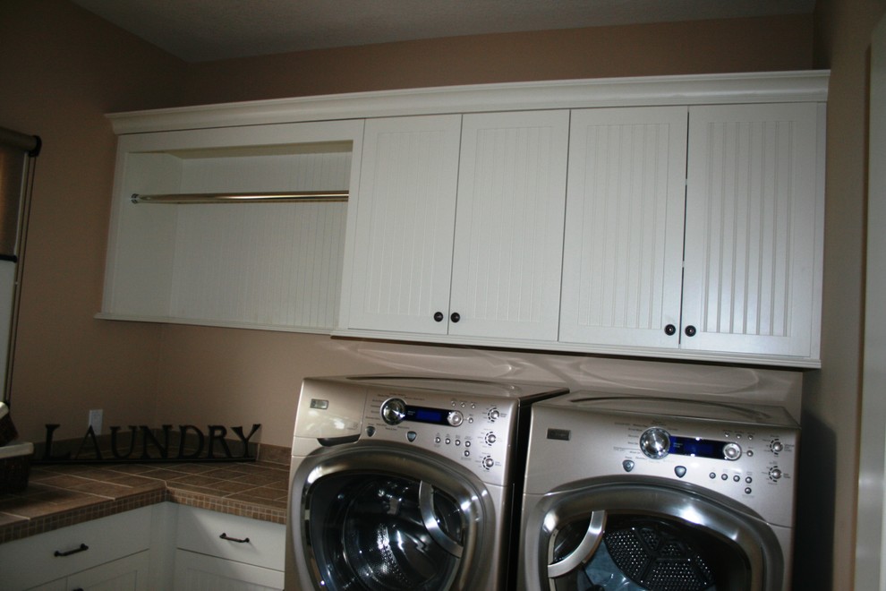 Example of a trendy laundry room design in Other